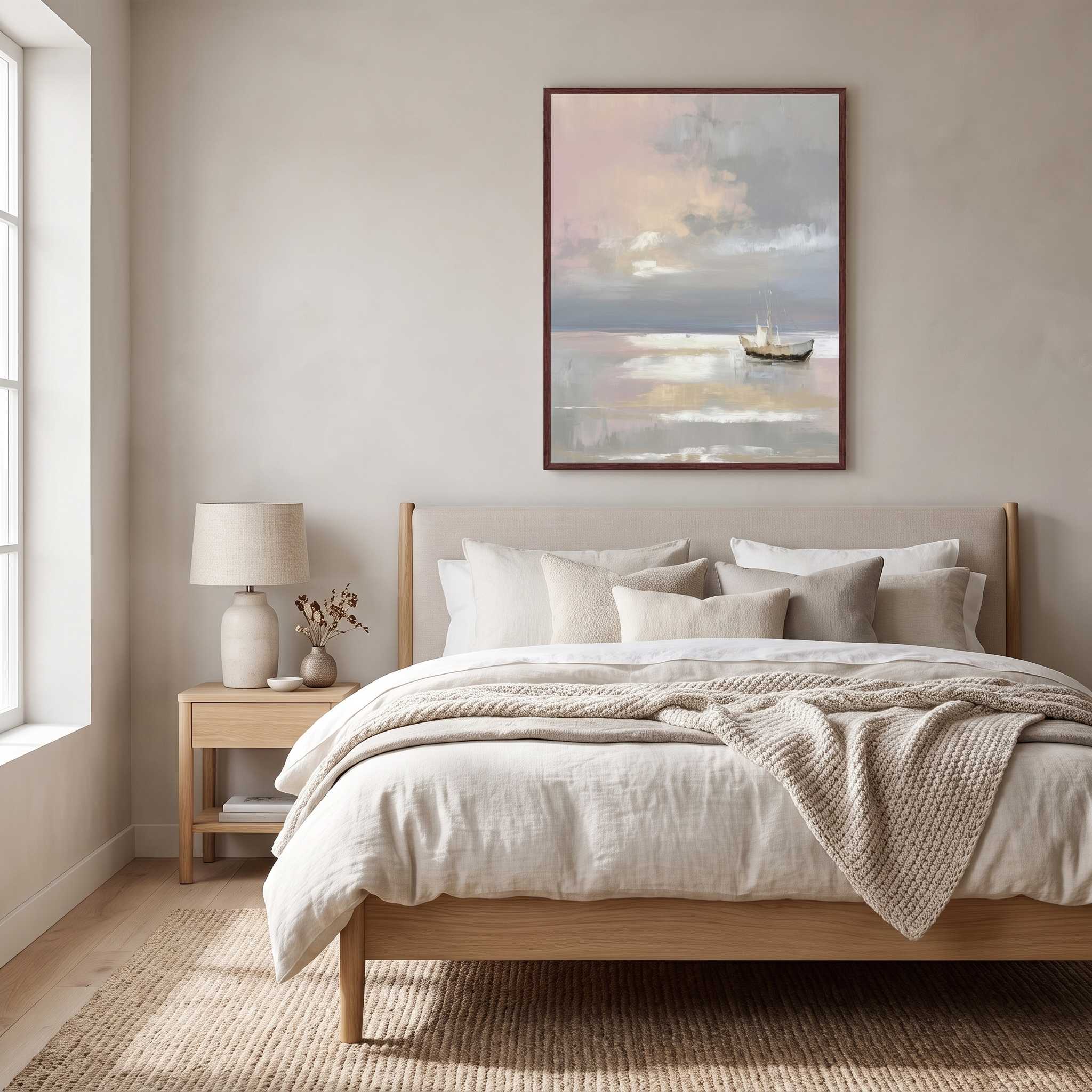 Framed Christian seascape print with a small sailboat on calm water, displayed above a bed in a bright neutral bedroom.