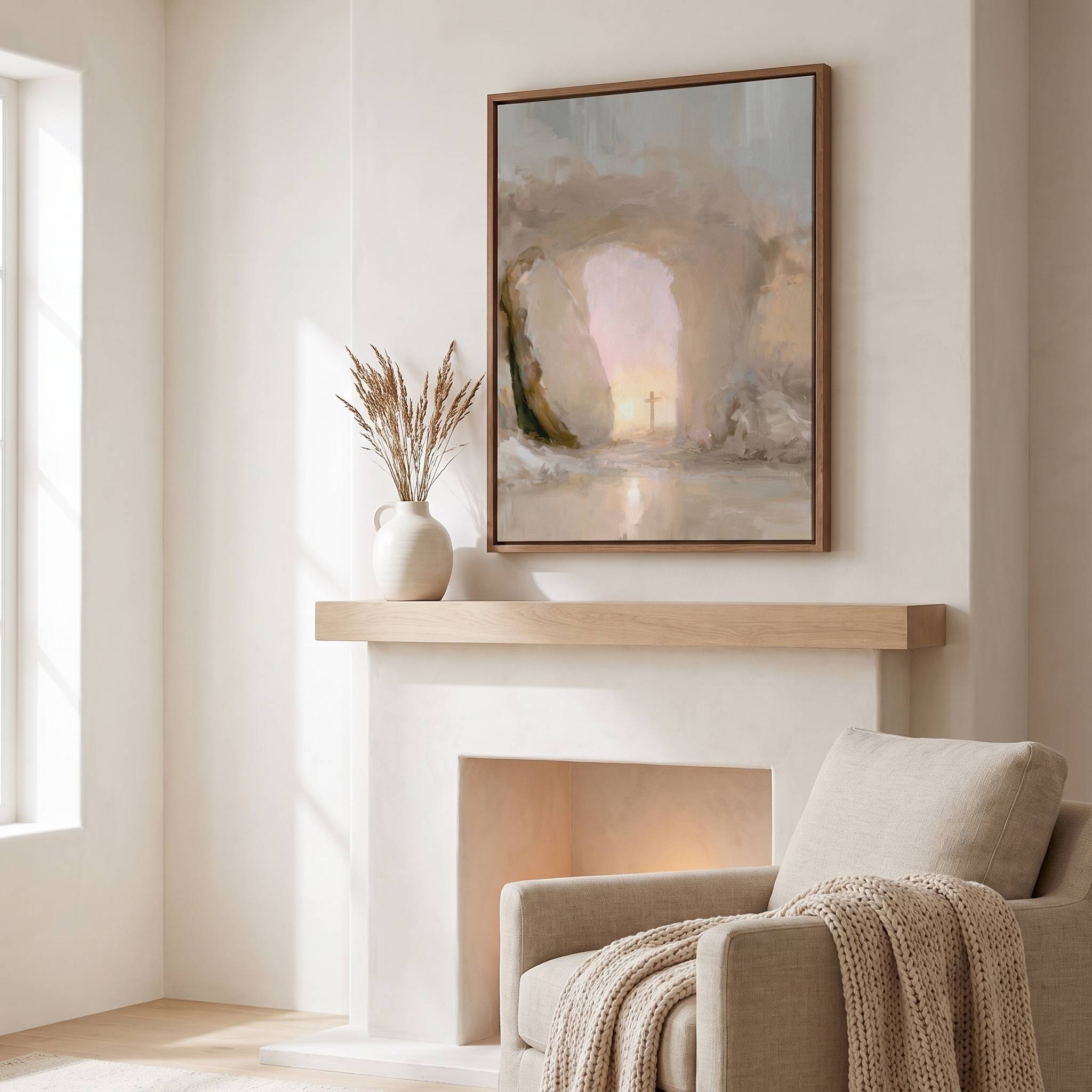 Framed empty tomb Christian wall art with a cross at sunrise, styled above a white fireplace mantel in a warm neutral living room.