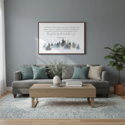 “Romans 8:11 Scripture forest canvas wall art styled above a modern gray sofa.”