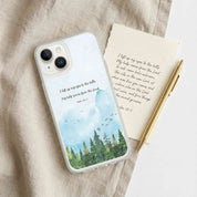 Phone case with nature design and text on a fabric background