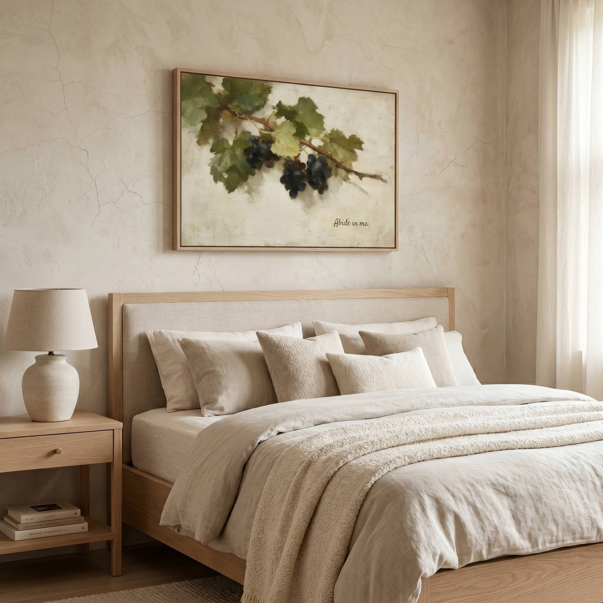 Abide in Me Christian wall art displayed above a bed in a serene bedroom, featuring a vintage grapevine design inspired by John 15 in a peaceful, modern farmhouse setting.
