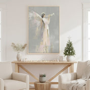 Close-up of angel with trumpet Christmas wall art displayed on a shelf with soft warm lighting.