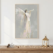 Christian Christmas canvas of an angel with a trumpet, soft golden tones, hanging above a mantel for peaceful holiday décor.