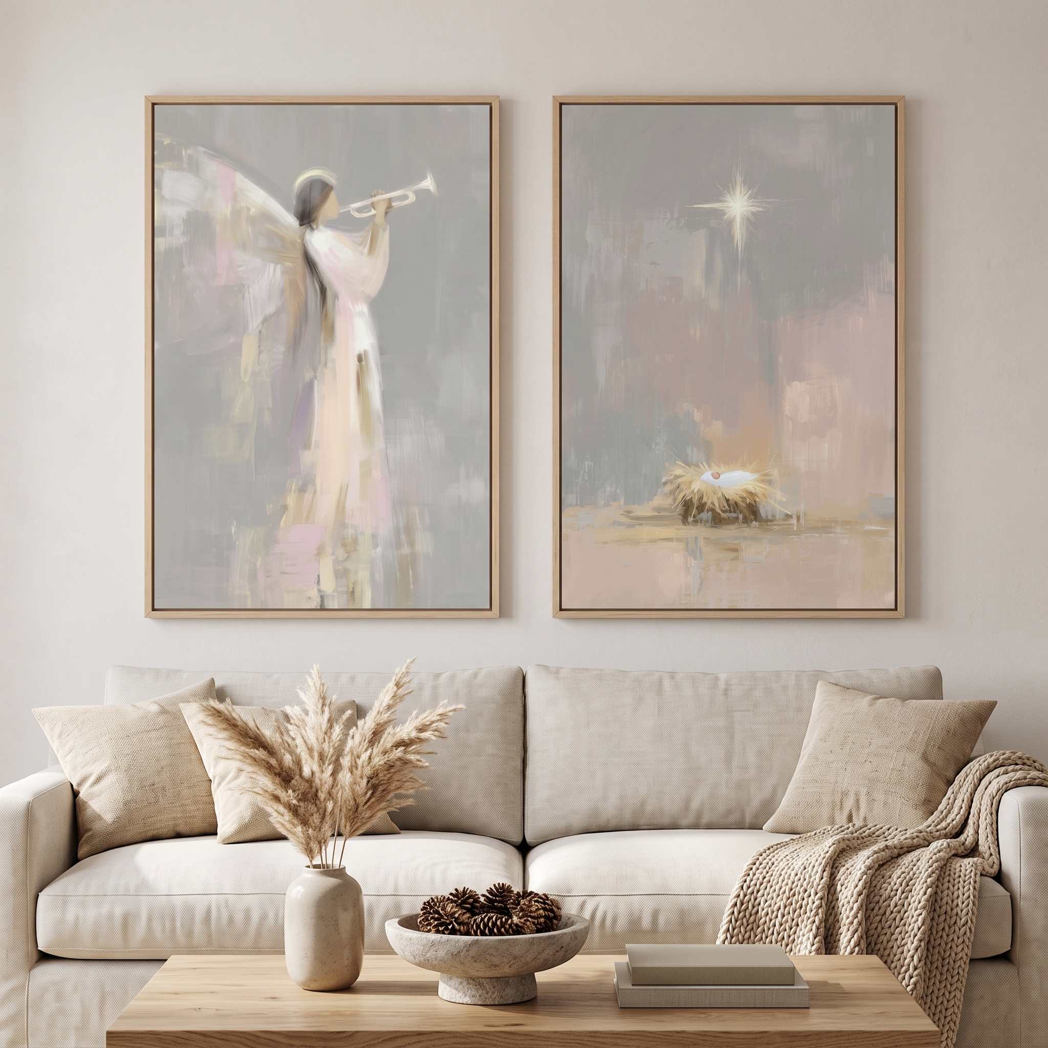 Christian Christmas wall art diptych above a beige sofa, with Baby Jesus in the manger and an angel playing a trumpet in soft watercolor tones.