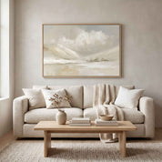 Framed vintage Christian winter landscape wall art titled Be Still and Know with Psalm 46:10 verse, displayed above a beige sofa in a soft organic modern living room.