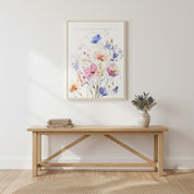 Framed Christian floral wall art of Ecclesiastes 3:11 with watercolor wildflowers, styled above a bench with greenery.