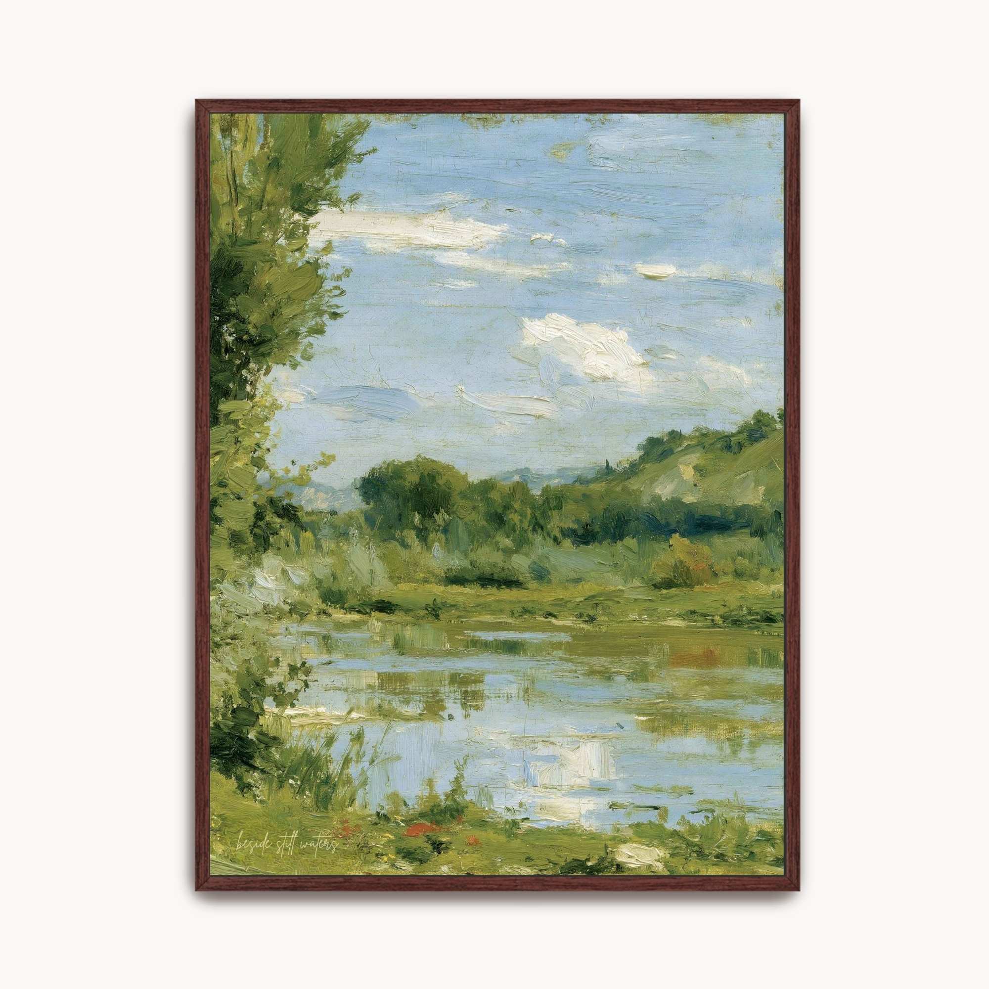Framed Beside Still Waters Christian watercolor landscape wall art featuring a serene river, green trees, and soft sky reflections inspired by Psalm 23.