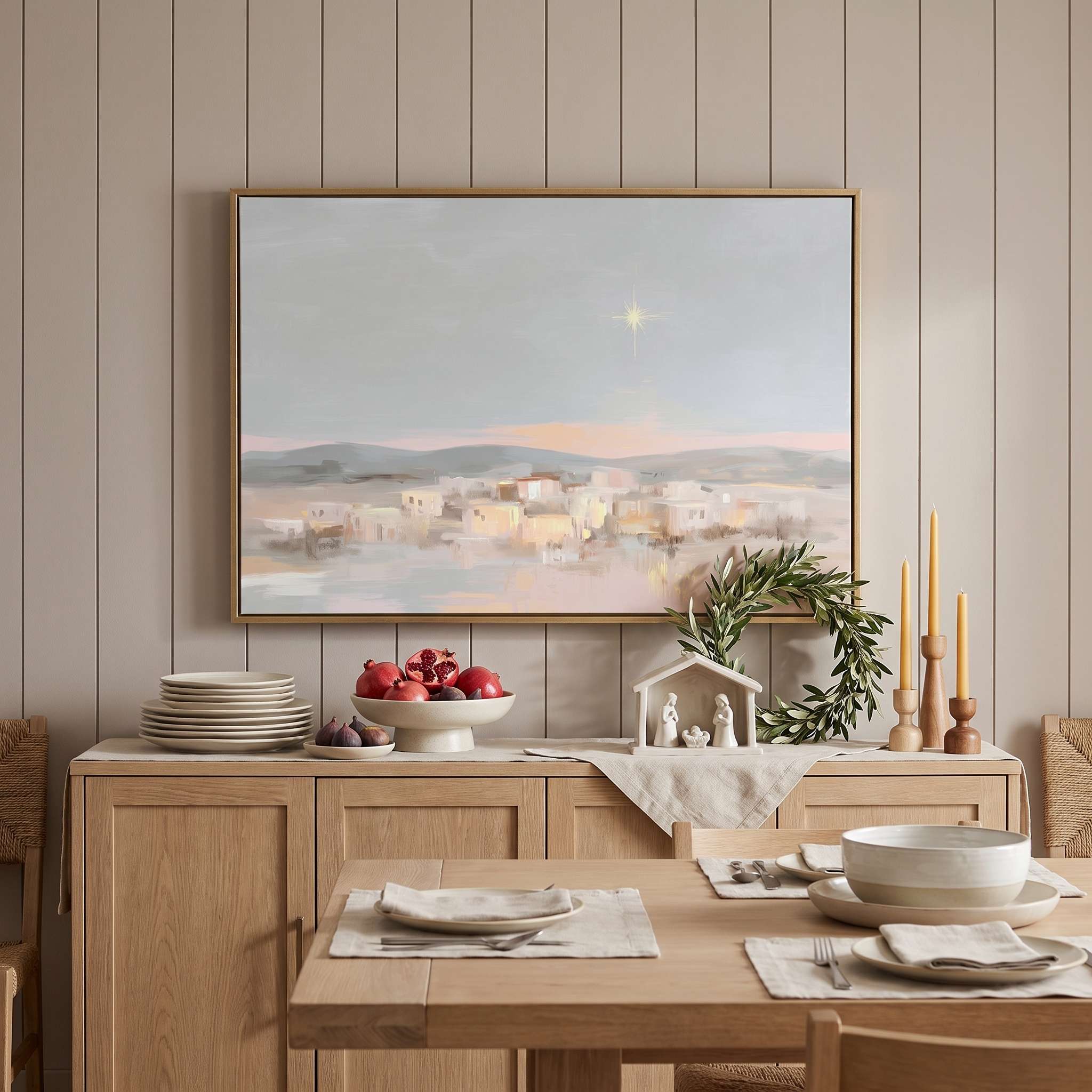 Framed Star of Bethlehem Nativity wall art showing a peaceful town beneath a radiant star, displayed above a wooden sideboard in a dining room.