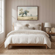 Framed vintage Jeremiah 17:7 Christian landscape canvas wall art hanging above a light wooden bed with cream bedding in a soft organic modern bedroom.