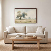 Framed vintage Jeremiah 17:7 Christian landscape canvas wall art hanging above a beige sofa and light wood coffee table in a soft organic modern living room.