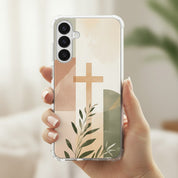 Christian cross Samsung phone case with minimalist beige botanical design held in hand in soft natural light symbolizing faith in Jesus Christ