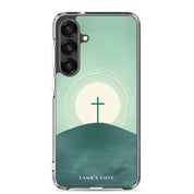 Minimalist Christian Samsung Galaxy s25 case featuring a black cross on a hill against a green and white sunrise landscape background