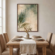Framed Christian palm leaf wall art above a natural wood dining table, adding botanical watercolor faith decor to a warm neutral dining room.