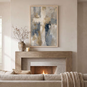 Framed contemporary abstract cross canvas wall art hanging above a rustic wood fireplace mantel in a modern living room setting.
