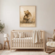 Deeply Loved bear and cub Christian nursery wall art in a light wood frame above a crib, with cream bedding and a rocking chair in a neutral baby room.