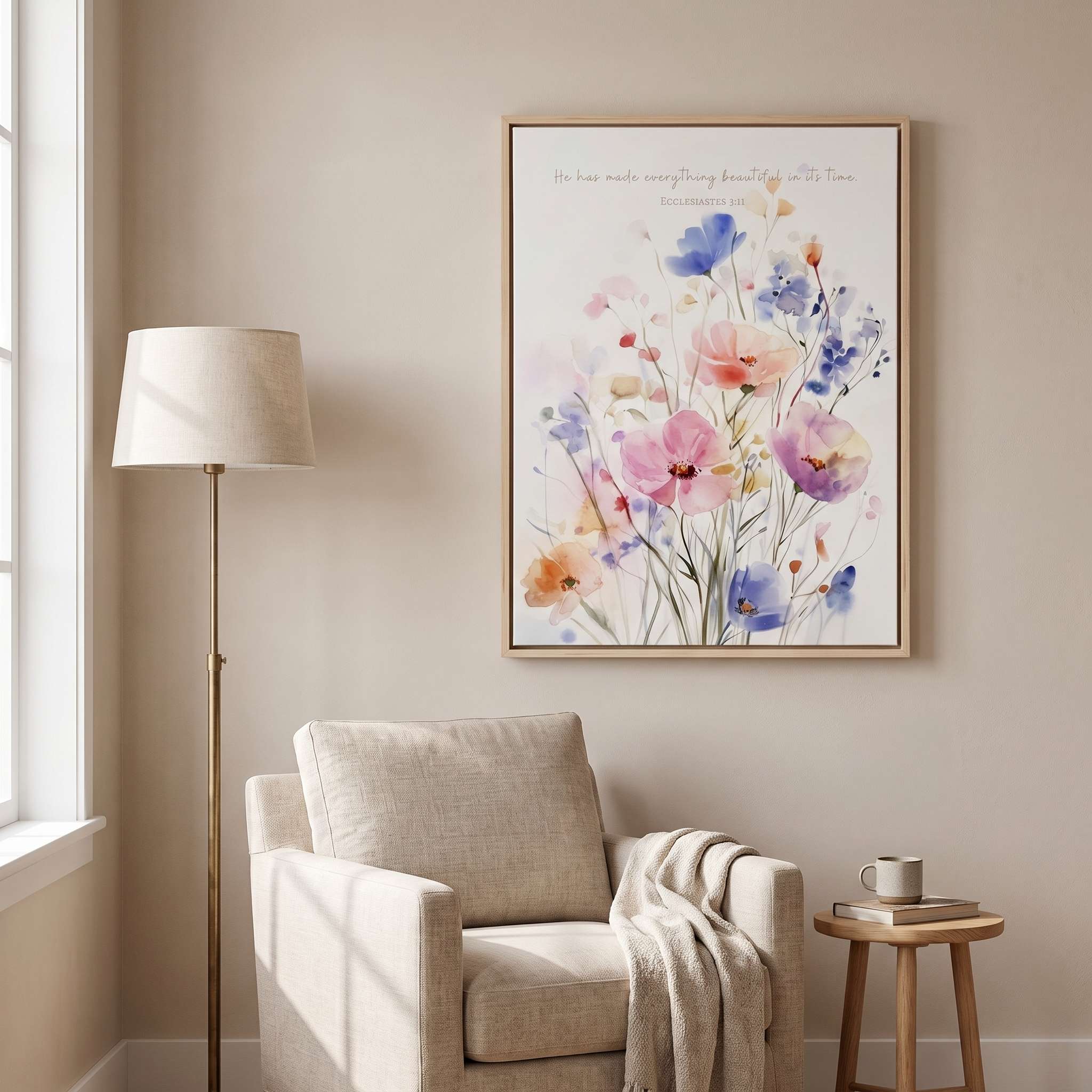 Ecclesiastes 3:11 watercolor floral wall art above a cozy armchair in a reading nook, with pastel wildflowers and a soft neutral interior.