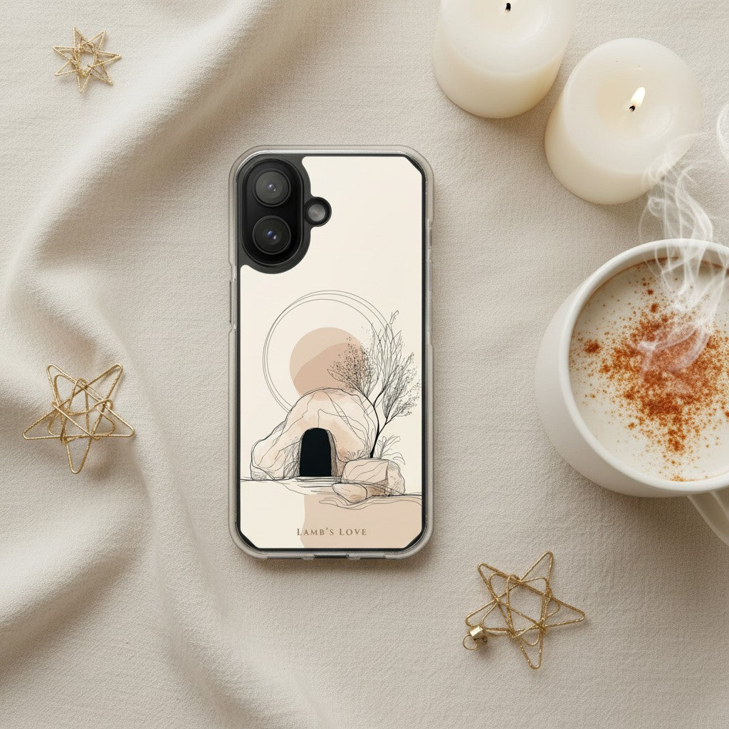 Empty Tomb Christian MagSafe iPhone case beside warm coffee and candles with cozy neutral Christmas flat lay aesthetic and resurrection-inspired artwork