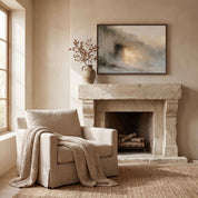 Framed abstract Empty Tomb Jesus Risen Christian landscape canvas wall art hanging above a rustic stone fireplace mantel with a beige armchair in a warm living room.