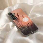 Samsung galaxy phone case with sunset design on a white fabric background