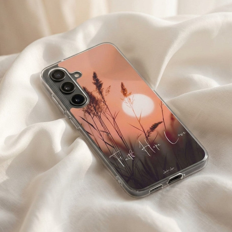 Samsung galaxy phone case with sunset design on a white fabric background
