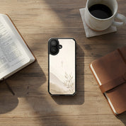 Faith Over Fear MagSafe® clear iPhone case featuring a minimalist Christian cross with soft neutral watercolor landscape artwork displayed beside an open Bible, coffee mug, and leather journal on a warm wooden table in a peaceful devotional setting