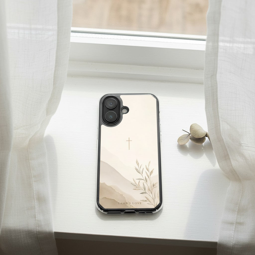 Faith Over Fear MagSafe® clear iPhone case featuring a minimalist Christian cross with soft neutral watercolor landscape artwork displayed on a bright white windowsill beside flowing curtains in a peaceful modern Christian aesthetic setting