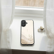 Faith Over Fear MagSafe® clear iPhone case featuring a minimalist Christian cross with soft neutral watercolor landscape artwork displayed on a bright white windowsill beside flowing curtains in a peaceful modern Christian aesthetic setting