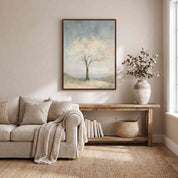 Framed Faithful to His Word almond blossom tree Christian wall art above a wooden console beside a cream sofa with a knitted throw in a neutral living room.
