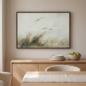 Framed vintage Isaiah 41:10 landscape canvas wall art hanging above a light wood sideboard with plates and a fruit bowl in a bright organic modern dining room.
