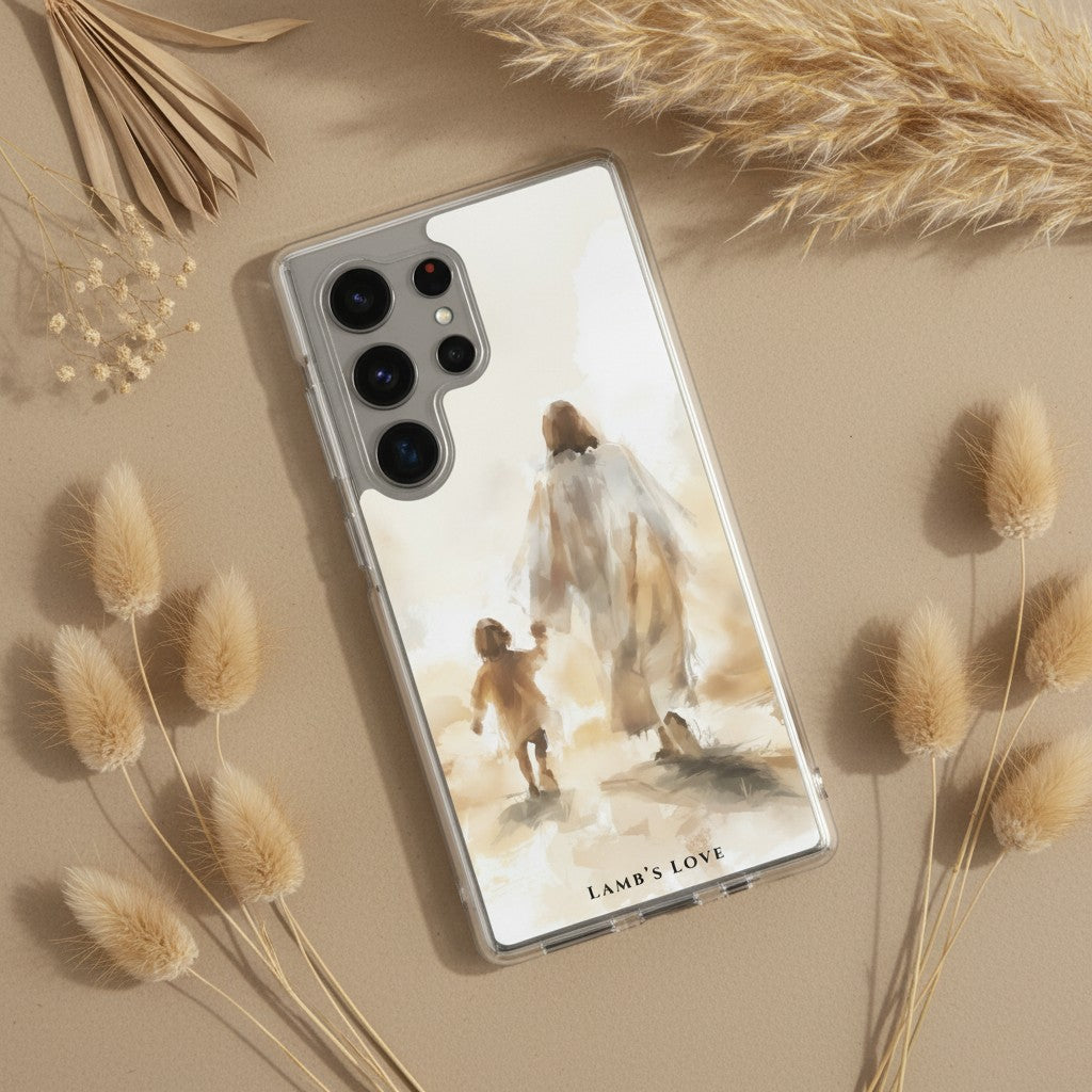 Christian Samsung Galaxy phone case with a watercolor design of Jesus walking with a child, styled on a beige surface with dried pampas grass and botanicals