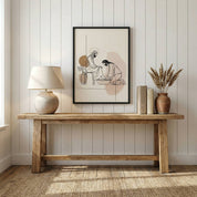 Minimalist foot washing Christian wall art displayed above wooden console table in modern neutral beige home