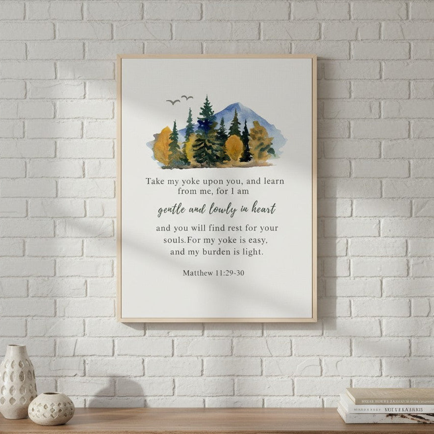 Framed artwork with nature scene and text on a white brick wall above a wooden shelf.