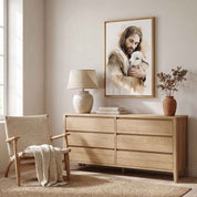 Jesus the Good Shepherd holding a lamb in vertical watercolor wall art above a light wood dresser in a warm neutral bedroom.
