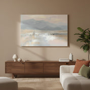 Good Shepherd Jesus and sheep wall art on a misty mountain shore, displayed above a walnut console beside a cream sofa in a living room.