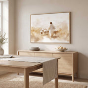 John 10:11 Good Shepherd watercolor wall art showing Jesus leading sheep, styled above a light wood sideboard in a neutral modern dining room.