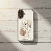 Good Shepherd Christian MagSafe iPhone case on rustic white painted wood background featuring minimalist artwork of Jesus holding a lamb with soft neutral faith-inspired aesthetic