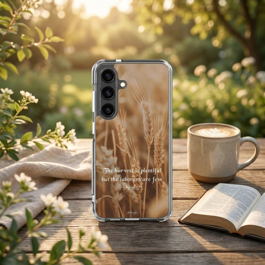 Phone case with wheat design and Bible verse on a table with a cup of coffee and open book.