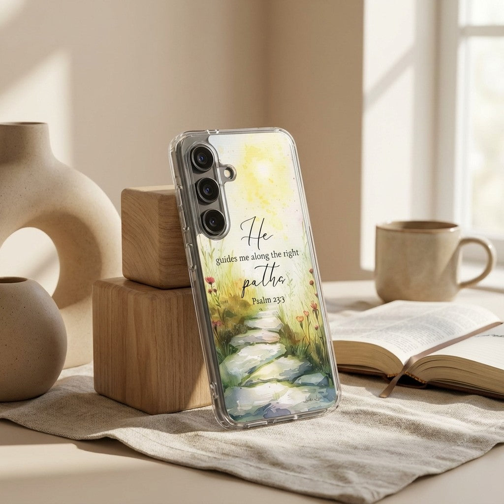 Samsung phone case with nature design and text on a table with decor items