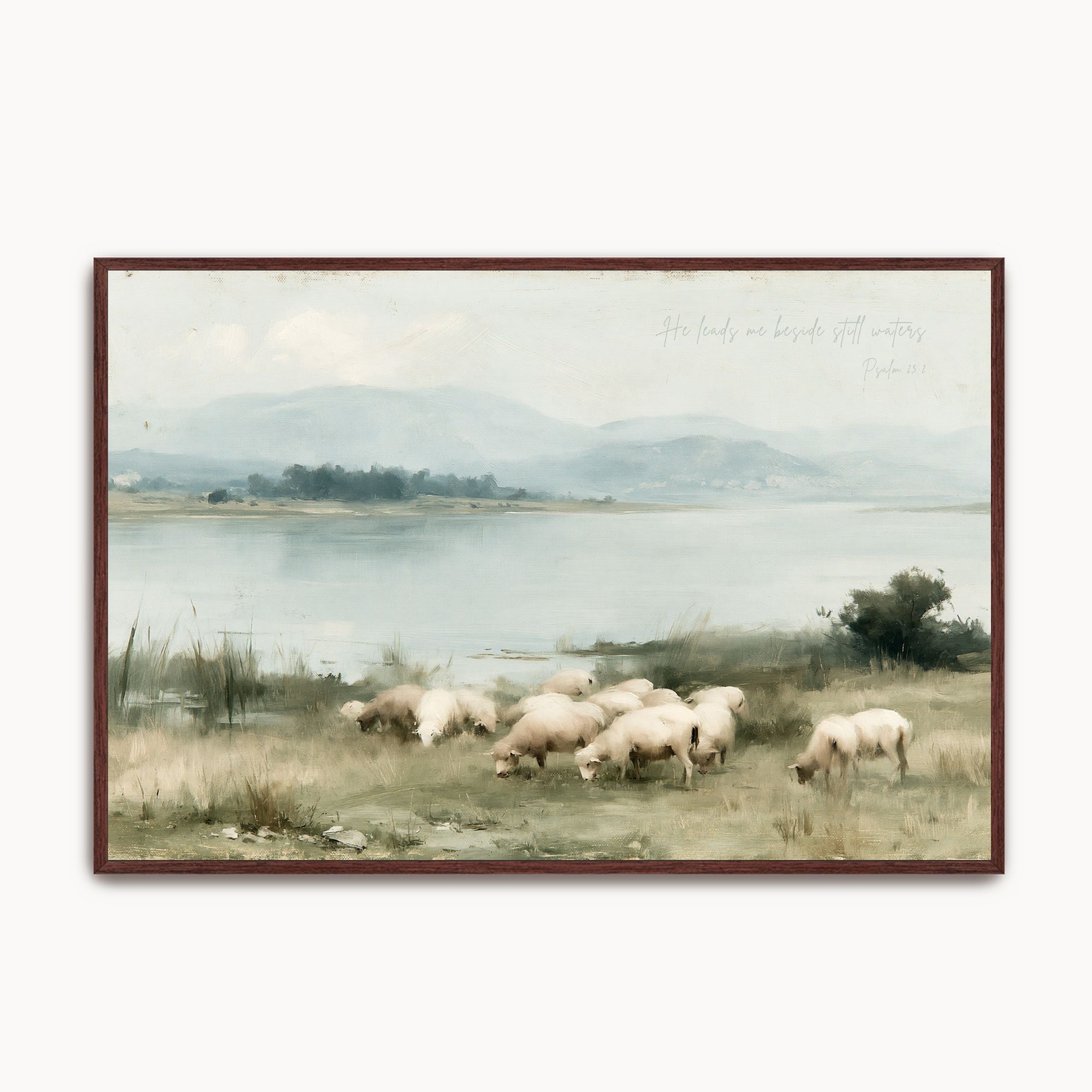 Framed vintage oil painting of sheep grazing beside still waters under rolling hills, featuring Psalm 23 scripture text "He leads me beside still waters".