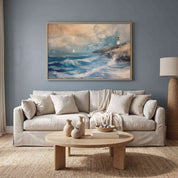 Framed vintage Christian seascape wall art titled He Made the Storm Be Still with Psalm 107:29 verse, depicting a dramatic stormy ocean, sailboat, and lighthouse, displayed on a blue-gray wall above a beige sofa in a soft organic modern living room.