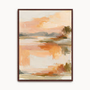 Contemporary abstract sunrise framed canvas wall art featuring soft brushstrokes of warm orange, peach, and beige, in a dark wood frame.
