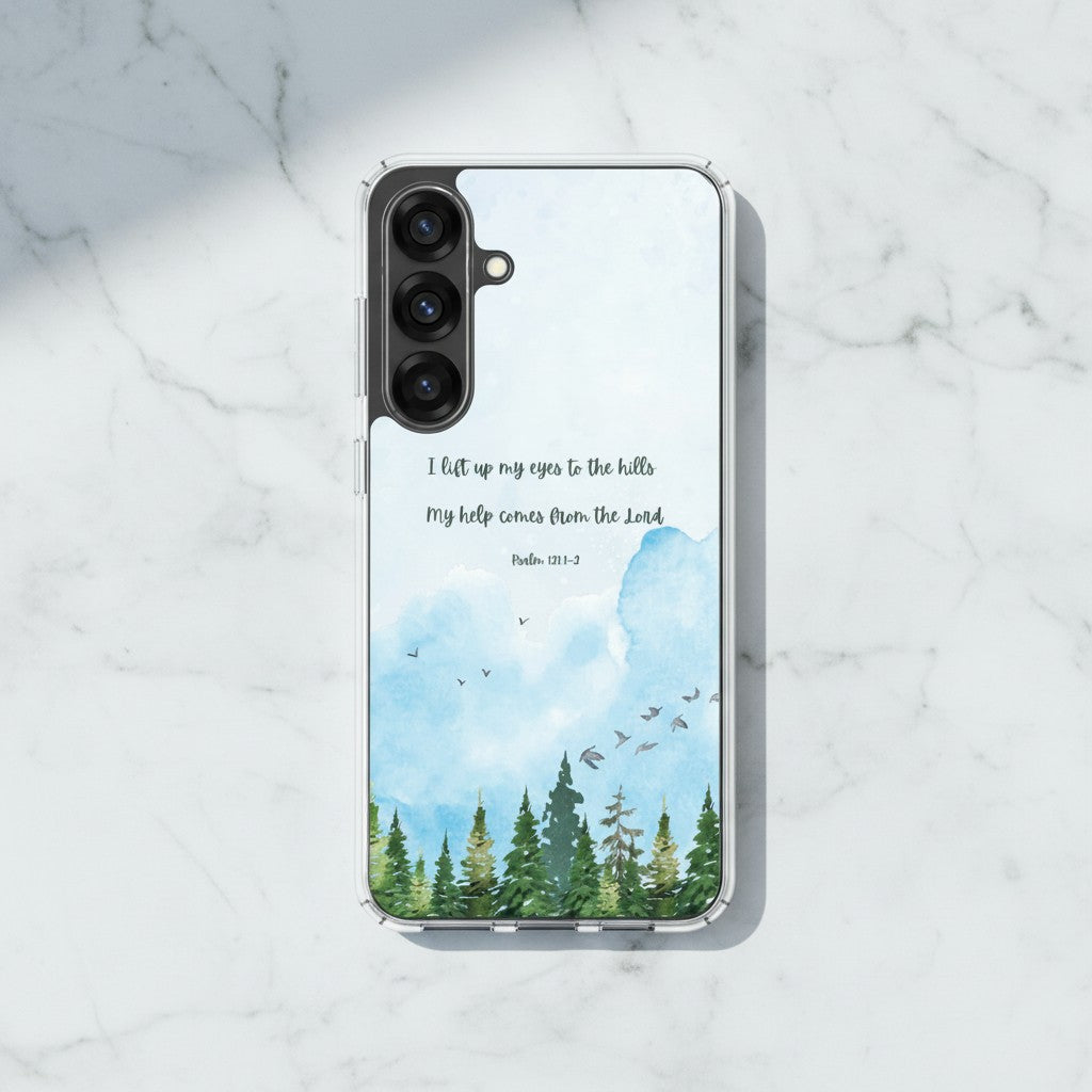 I Lift Up My Eyes Christian Samsung Galaxy phone case with a blue watercolor mountain landscape and Psalm 121:1-2 Bible verse, displayed on a white marble surface.