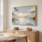 Framed abstract Psalm 36:9 Christian landscape canvas wall art featuring golden light and soft blue water hanging on a shiplap wall above a light wood sideboard in a Scandinavian dining room.