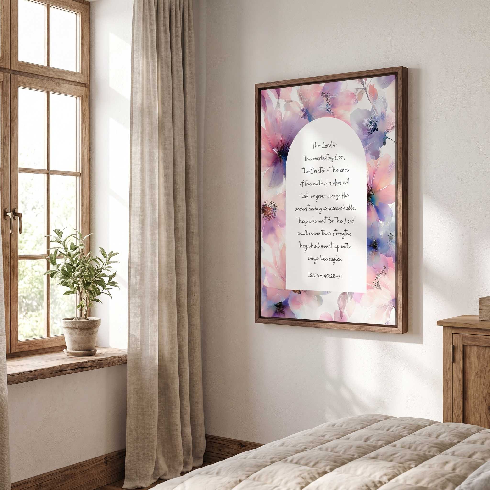 Framed vintage Christian floral wall art titled Isaiah 40:28–31 featuring "Those who hope in the Lord" with watercolor botanical artwork, displayed in a wood frame on a wall next to a tall window in a bright rustic bedroom.