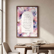 Framed vintage Christian floral wall art titled Isaiah 40:28–31 featuring "Those who hope in the Lord" with watercolor botanical artwork, displayed in a dark wood frame on a beige wall above a set dining table in a soft organic modern dining room.
