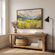 Isaiah 55:12 mountain landscape Scripture wall art with a colorful wildflower meadow, styled above a rustic console table in a bright living room.