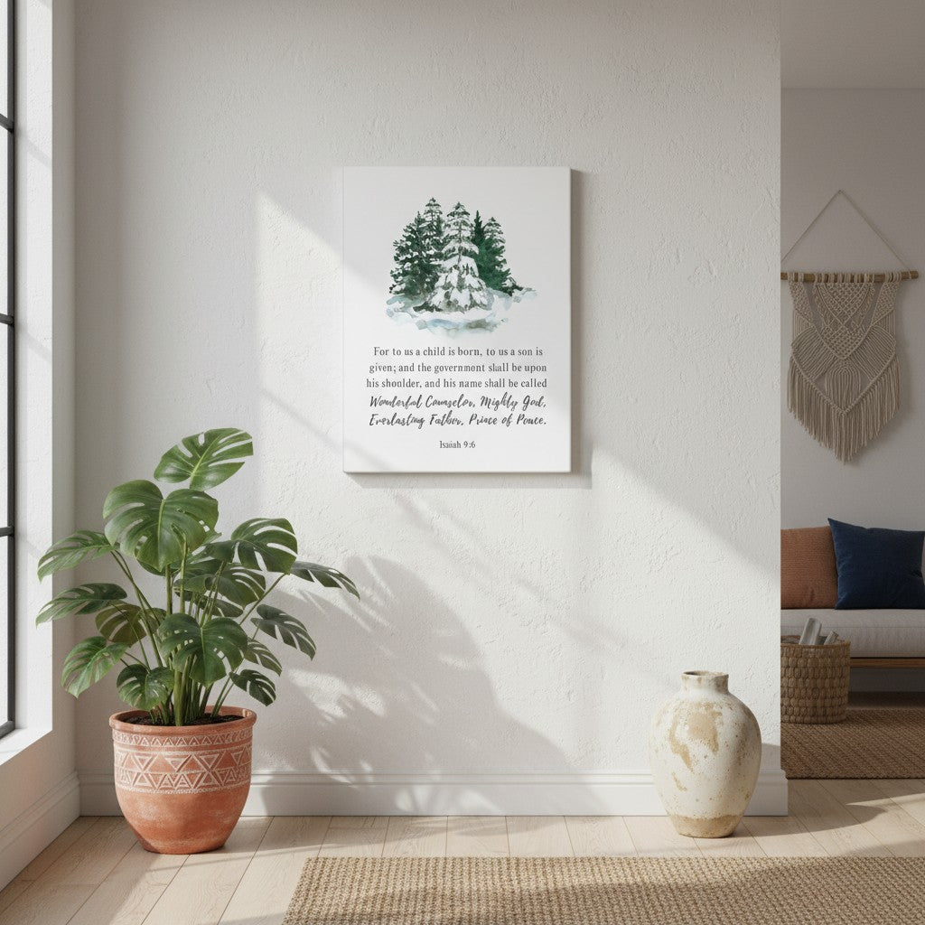 Christian canvas wall art with Isaiah 9:6 Bible verse and watercolor evergreen trees, displayed on a bright white wall with natural sunlight.