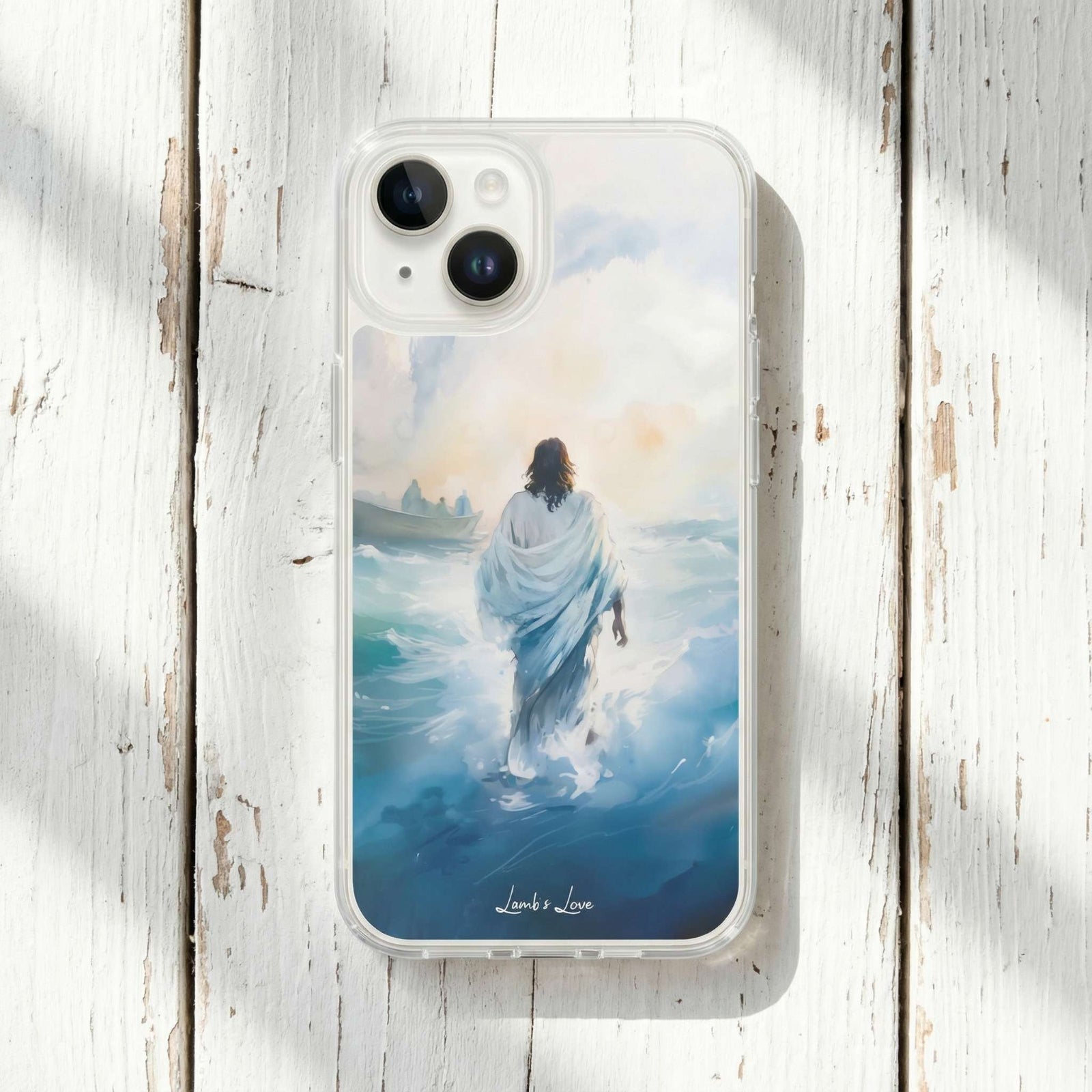 Phone case with a design of Jesus walking on water, placed on a wooden surface.