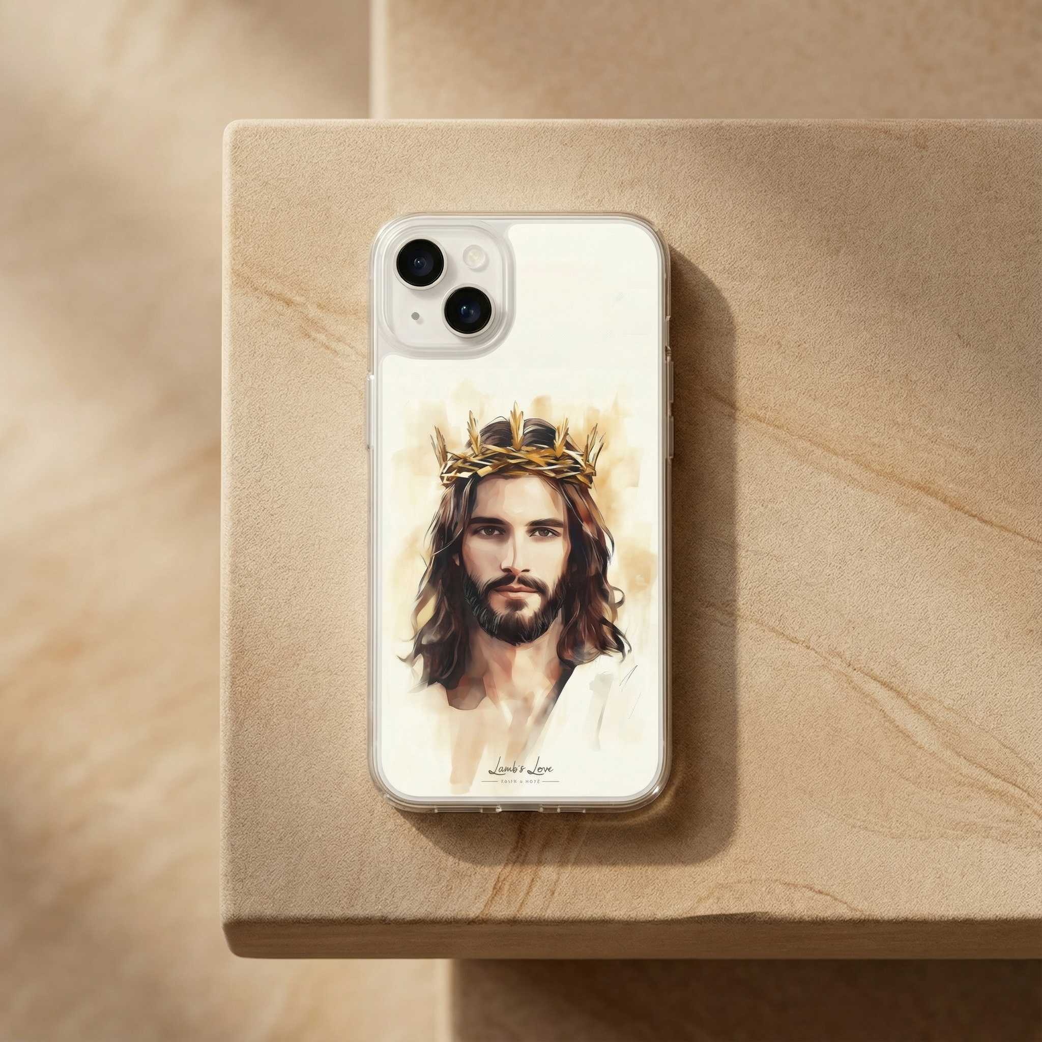 Phone case with a portrait of Jesus wearing a crown on a beige surface
