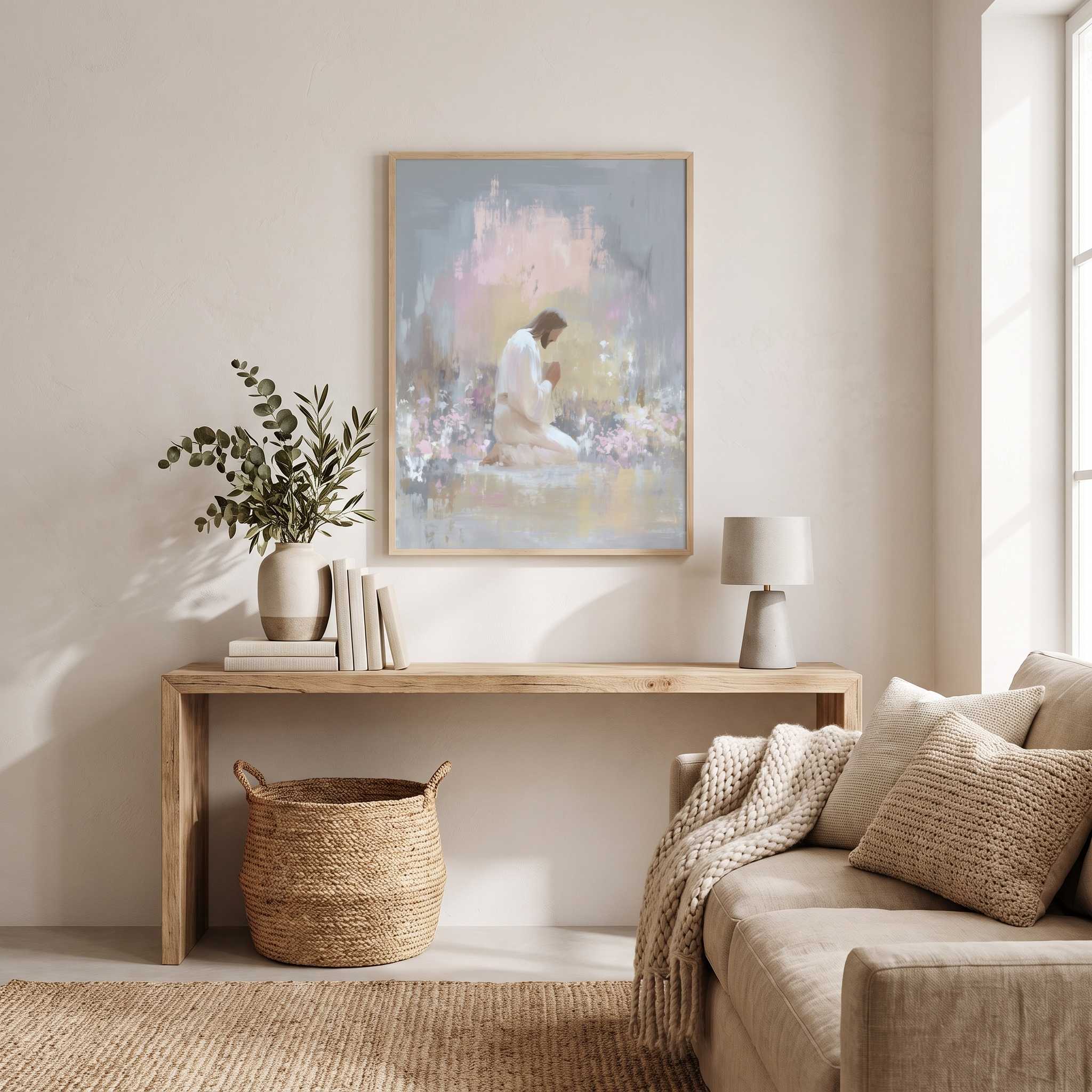 Jesus praying in Gethsemane framed Christian wall art displayed above a wooden console table in a bright living room.